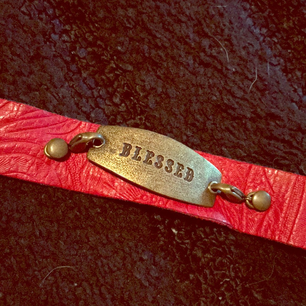 Red leather bracelet with charm